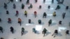 THAILAND -- People practice social distancing as they sit on chairs spread apart in a waiting area for take-away food orders at a shopping mall in hopes of preventing the spread of the coronavirus in Bangkok, Thailand, Tuesday, March 24, 2020. 