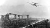 A U.S. transport aircraft flies over Berlin's Tempelhof Airport in June 1948 