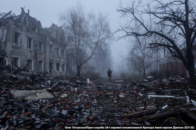 Scorched earth. A Ukrainian soldier walks down a street among residential buildings damaged by a Russian military strike. Kostyantynivka, Donetsk region, November 28, 2025