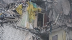 Rescuers Scramble To Find Survivors Of Deadly Russian Strike On Kyiv