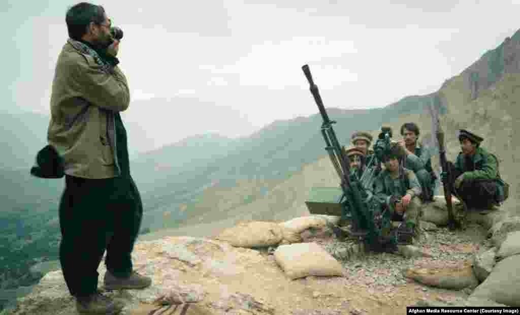 A photographer snaps a portrait of mujahedin. Beginning in 1985, American journalists began training Afghans in visual reporting.