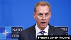 Acting U.S. Secretary of Defense Patrick Shanahan speaks to reporters in Brussels on February 14.