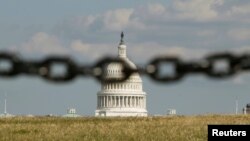 U.S. -- The Capitol is photographed through a chain fence in Washington September 30, 2013