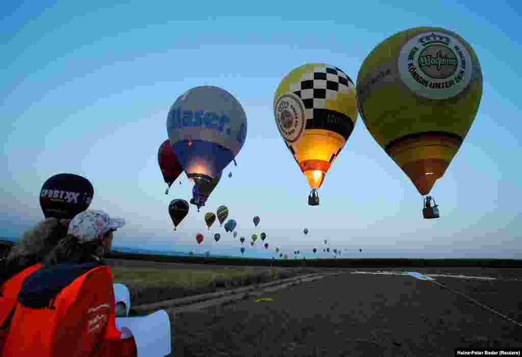 Judges watch competitors approaching a target during the FAI World Hot Air Balloon Championship near Gross-Siegharts, Austria,&nbsp; on August 20. (Reuters/Heinz-Peter Bader)