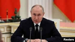 Președintele rus Vladimir Putin în cursul întâlnirii cu reprezentanți ai forțelor armate la Kremlin, Moscova, Rusia, 27 iunie 2023.