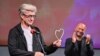 Bosnia and Herzegovina, Sarajevo, Wim Wenders (left), was presented with the Honorary Heart of Sarajevo for his exceptional contribution to the art of film at the Opening Ceremony of Sarajevo Film Festival. August 13, 2021 