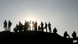 Palestinians inspect the damage at a smuggling tunnel following an Israeli air strike on the site at the border between Egypt and Gaza Strip in Rafah. 