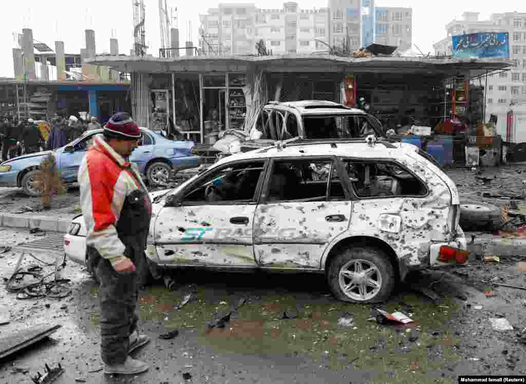 The blast set surrounding civilian vehicles on fire, and also damaged nearby buildings and shops. 