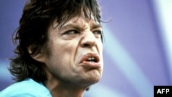 Sweden -- Mick Jagger, lead singer for the rock group the "Rolling Stones" performs with his band in the Ullevi Stadium in Gothenburg, June 19, 1982