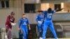 FILE: Kieran Powell (L) of West Indies caught by Afghanistan's Mohammad Nabi (C) bowled Rashid Khan Arman in a June one-day international competition.