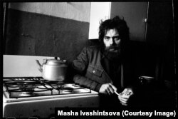 Poet Viktor Krivulin sitting in a Leningrad kitchen in 1978.