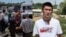 The cover image for the video depicts a conflict between a farmer and market traders in Osh, a city in southern Kyrgyzstan