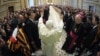 Pope Benedict XVI waves as he arrives at a private audience at the Vatican in 2011.