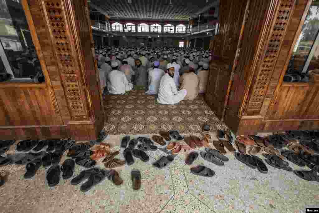 Pakistani religious students attend a lesson at Darul Uloom Haqqania, an Islamic seminary and the alma mater of several Taliban leaders, in Akora Khattak, Khyber Pakhtunkhwa province, on September 15. (Reuters/Zohra Bensemra)