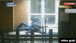 The video, broadcast by Gazprom subsidiary NTV, shows a uniformed man spring from a guard station and tackle the diplomat after the latter exits a taxi and heads toward the embassy door. 