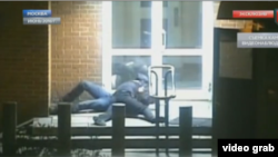 The video, broadcast by Gazprom subsidiary NTV, shows a uniformed man spring from a guard station and tackle the diplomat after the latter exits a taxi and heads toward the embassy door.