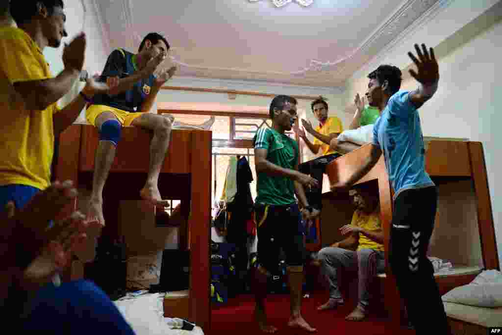 Afghan soccer players dance in their dorm room in Kabul.