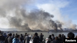 Հարավկորեական Յոնգպյանգ կղզուց ծուխ է բարձրանում հրետակոծությունից հետո, 23-ը նոյեմբերի, 2010թ.