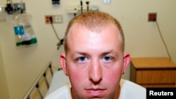 U.S. -- Missouri police officer Darren Wilson in a photo taken shortly after August 9, 2014 shooting of Michael Brown