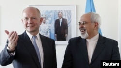 British Foreign Secretary William Hague (left) meets with Iranian Foreign Minister Mohammad Javad Zarif at the United Nations in New York on September 23.