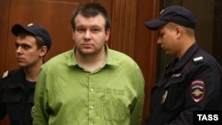 Nikolai Kavkazsky (center) attends a court hearing in Moscow in July 2013.