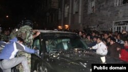 Hardliners attack the car of Iranian opposition leader Mehdi Karrubi in Qazvin