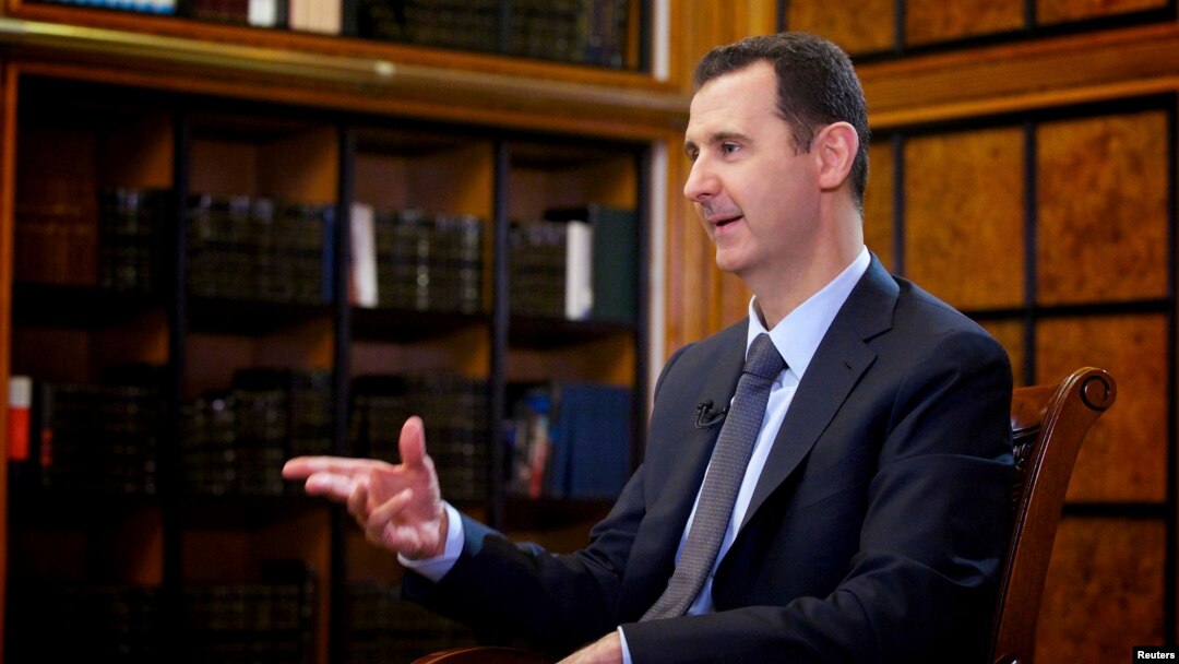 Syrian President Bashar al-Assad speaks during an interview with Russian state television in Damascus on September 12.