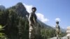 Indian paramilitary soldiers stand guard at a check post some 81 kilometers from Srinagar, the summer capital of Indian Kashmir. (file photo) 