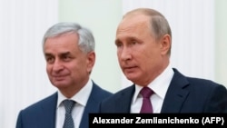 Russian President Vladimir Putin (right) with Abkhazia's separatist leader Raul Khajimba in Moscow last year. 