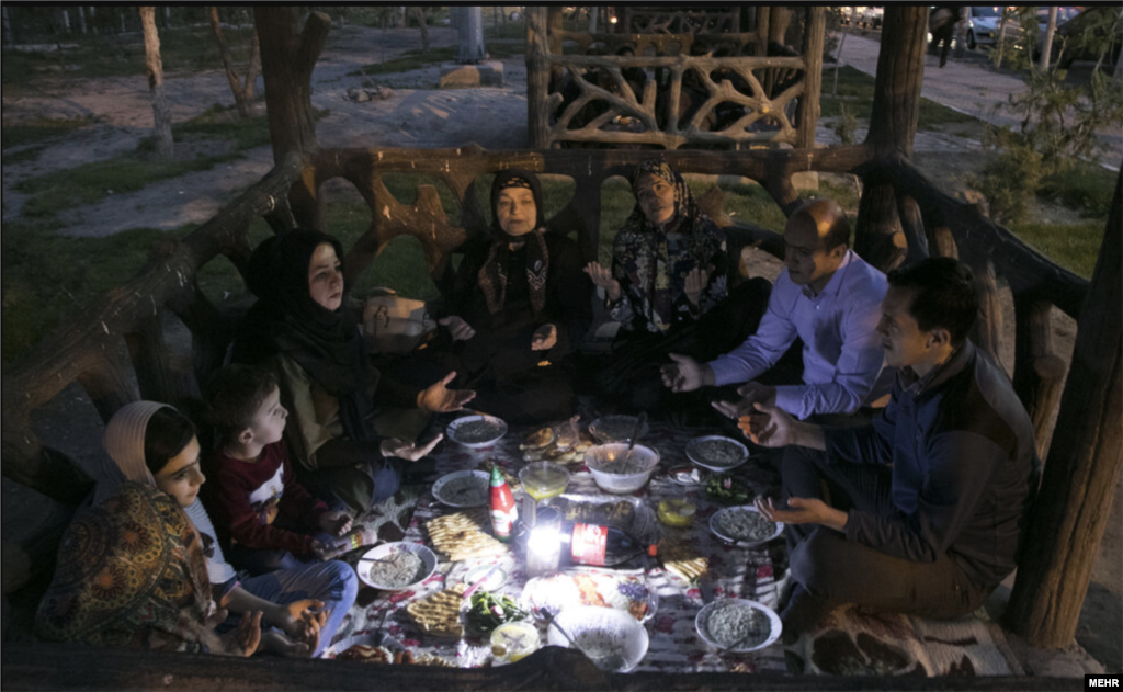 A family in the Iranian capital, Tehran, break their daily Ramadan fast. Throughout the holy month Muslims are&nbsp;not permitted to eat or drink during the day. The Ramadan fast is intended to bring the faithful closer to God and to remind them of the suffering of those less fortunate.