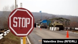 Moldova - STOP road sign, checkpoint of peacekeeping troops, Vadul lui Voda, the bridge over the Dniester River, 09Jan2012