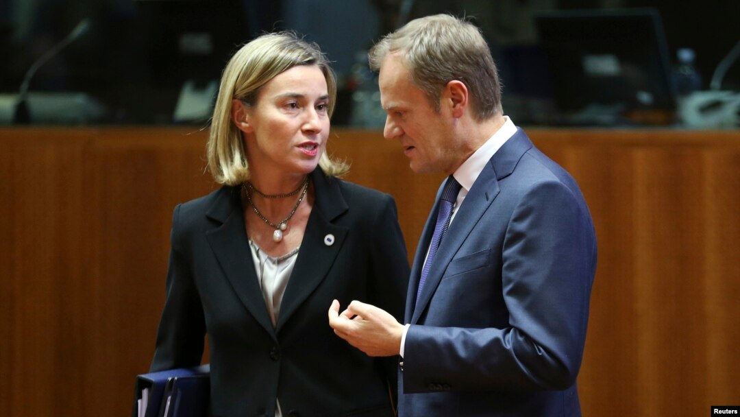  EU foreign policy chief Federica Mogherini talks to European Council President Donald Tusk during an EU leaders summit in Brussels, December 18.