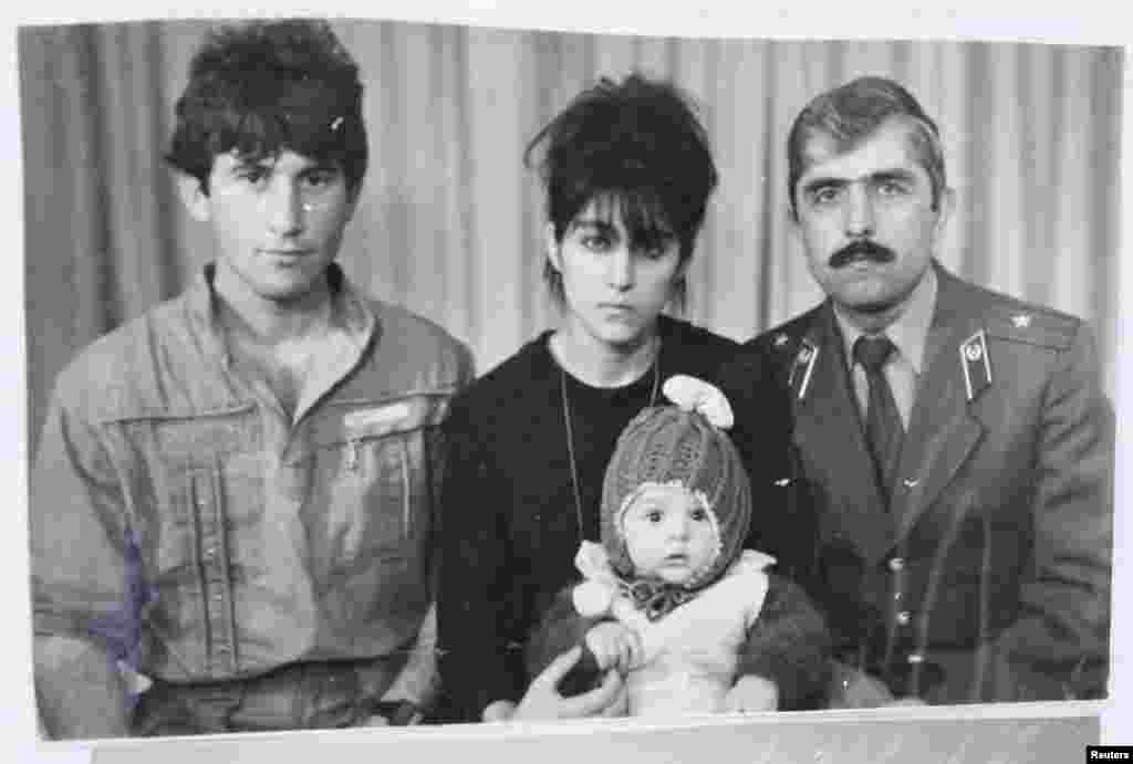 A photo, showing Tamerlan Tsarnaev as an infant (center), with his father Anzor (left), mother Zubeidat, and uncle Muhammad Suleimanov (right) in Makhachkala, Daghestan.&nbsp;