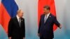 Chinese leader Xi Jinping welcomes Russian President Vladimir Putin after the photo session of the Shanghai Cooperation Organization on September 1.