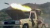 This screen grab taken from video footage released on September 8 by the Saudi-backed National Resistance Forces in Yemen shows a rocket being fired from a vehicle-based launcher in Yemen's western Taiz Province.
