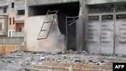 An image grab taken from a video uploaded on YouTube on February 7 shows what Syrian opposition activists described as shelling on a school in the Baba Amro district of the restive city of Homs in central Syria.