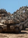 A convoy of Israeli tanks is deployed at Israel's border with the Gaza Strip on September 16, 2025.