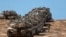 A convoy of Israeli tanks is deployed at Israel's border with the Gaza Strip on September 16, 2025.