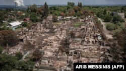 Разрушены дома в городе Привилье Луганской области в результате масштабного вторжения России в Украину, 14 июня 2022 года