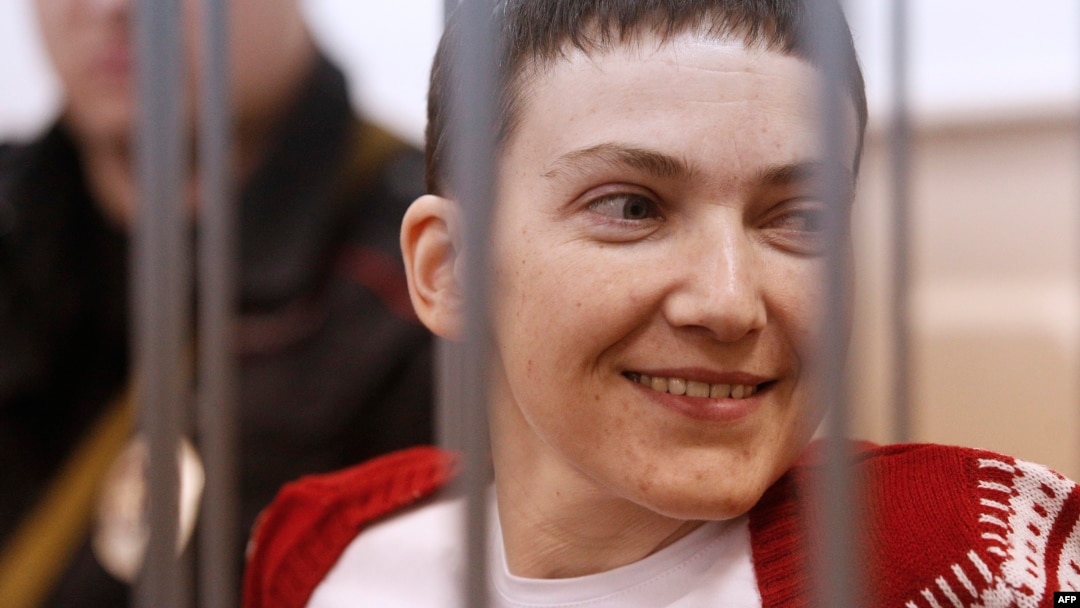 Ukrainian pilot Nadia Savchenko stands inside a defendant's cage during her hearing in the Basmanny district court in Moscow on February 10.