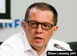 Ukrainian journalist Roman Sushchenko speaks during a press conference in Kyiv on September 11.