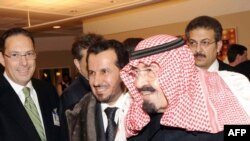 Saudi King Abdullah bin Abdul Aziz (right) leaving a New York hospital last year