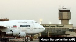 In this June 2003 file photo a Boeing 747 of Iran's national airline is parked at Mehrabad International airport in Tehran, Iran.