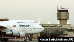 Iran - A Boeing 747 of Iran's national airline is parked at Mehrabad International airport in Tehran, June 2003.