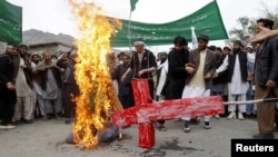Afghans shout anti-U.S. slogans during a demonstration on March 13 in Jalalabad Province against the killings of 16 Afghans, allegedly by a rogue U.S. soldier.