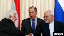 Foreign Ministers, Sergei Lavrov (C) of Russia, Walid al-Muallem (L) of Syria and Mohammad Javad Zarif of Iran, attend a news conference in Moscow, April 14, 2017