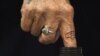 An Iraqi woman dips her finger in ink as she votes in a primary election in Baghdad in October.