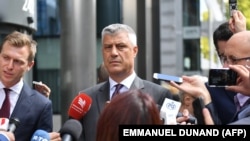 Kosovar President Hashim Thaci talks to the press after meeting with Serbian President Aleksandar Vucic and EU foreign policy chief Federica Mogherini in Brussels on September 7.