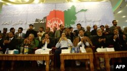 Ahmad Zia Masud (from left), Abdul Rashid Dostum, Salahuddin Rabbani, Atta Mohammad Noor, Mohammad Mohaqiq, Abdullah Abdullah, and Mohammad Yunus Qanuni pray at a meeting in Kabul on August 29.