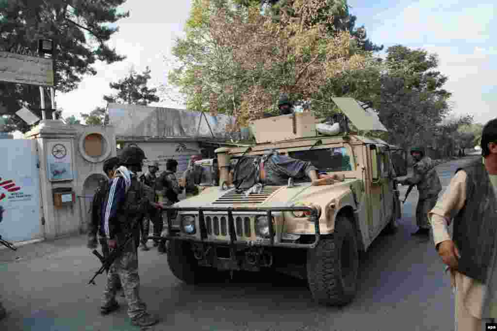 Afghan security forces moving an injured civilian to a local hospital in Kunduz on October 3.